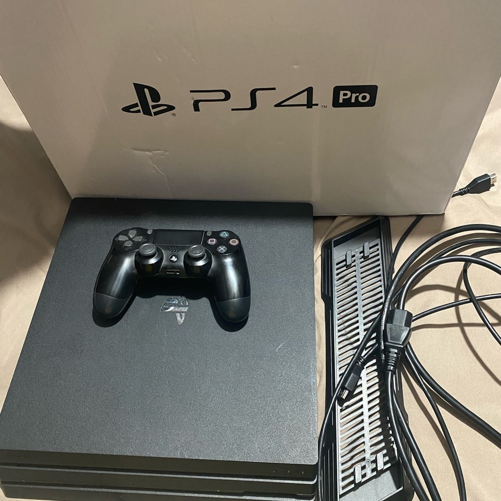 Used PS4 Pro- well kept. Upgraded to PS5